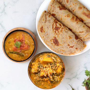 Lasooni Methi Kip, Gele Dal Tadka, Paratha Thali