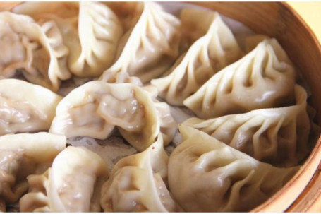 Steamed Chicken Dumplings Jī Ròu Jiǎo Zi