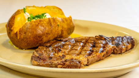 Ribeye Hand Cut Grilled To Perfection With Two Sides