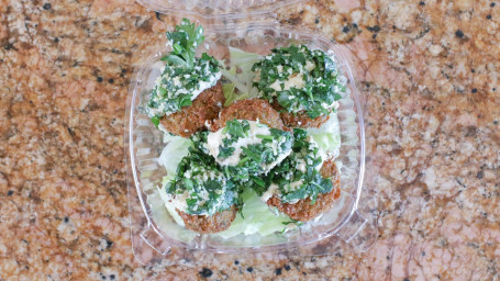 5 Falafel Balls Dipped With Hummus Tabouli